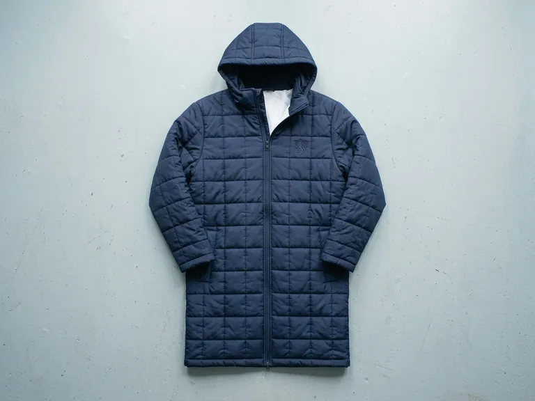 Giacca da panchina lunga, imbottita, blu scuro con cappuccio